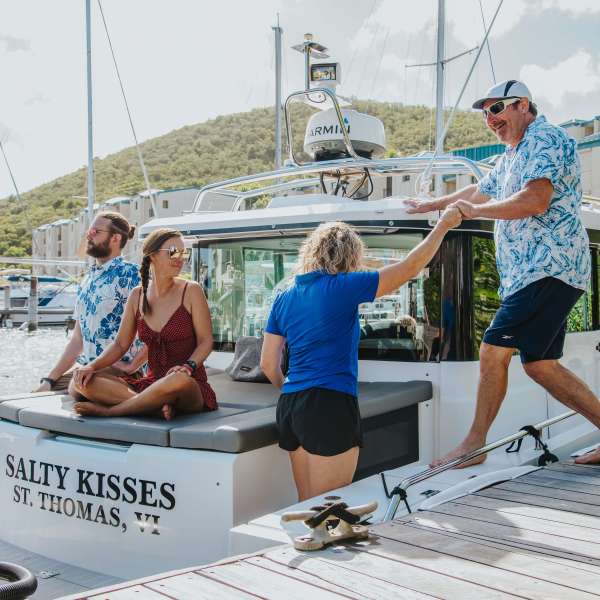 a group of people riding on the back of a boat
