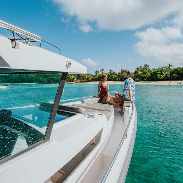 a close up of a boat next to a body of water