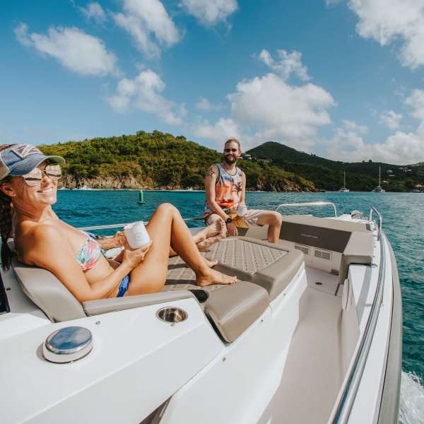 a person sitting on a boat in a body of water