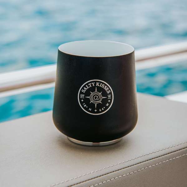 a close up of a coffee cup sitting on a table